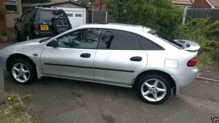 1998 MAZDA 323 GXI SILVER