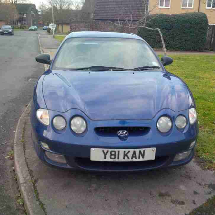 2001 HYUNDAI COUPE SI BLUE.....DRIVES BUT CLUTCH SLIPPING/FRONT WHEEL BEARING/