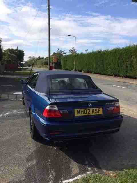 325i Auto Convertible in Topaz blue with matching blue roof