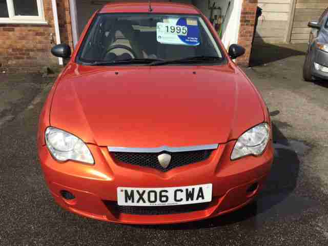 Proton GEN-2 1.6 GLS Petrol Hatchback in Metallic Burnt Orange