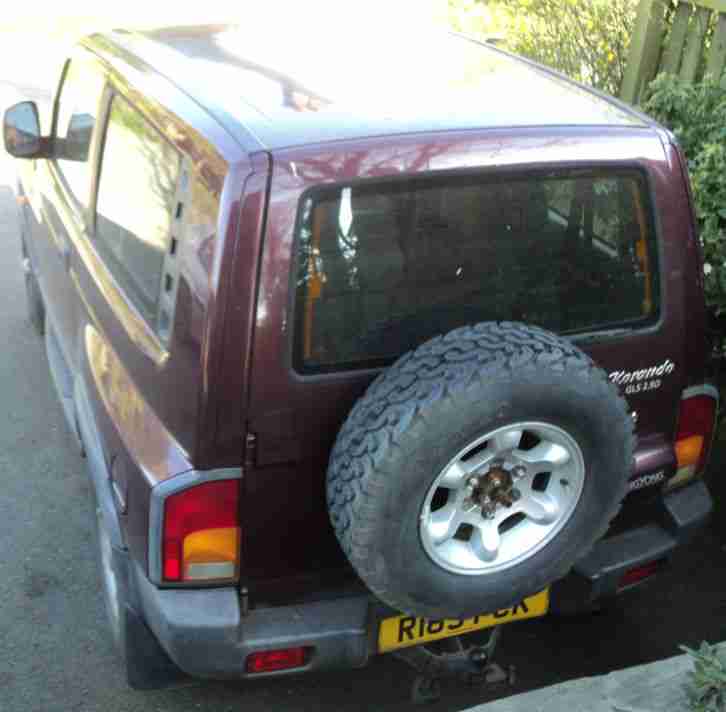 SSANGYONG KORANDO 4X4 (R REG), MAROON COLOUR.