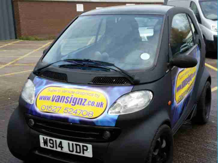 STEALTH SMART! ORIGINALLY SILVER; WRAPPED IN MATT BLACK & CARBON.