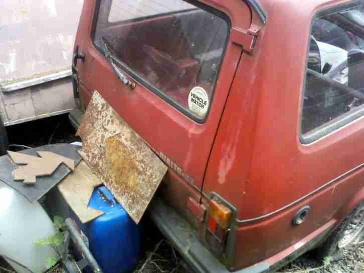 Stripped reliant rolling shell for banger racing part stripped engine